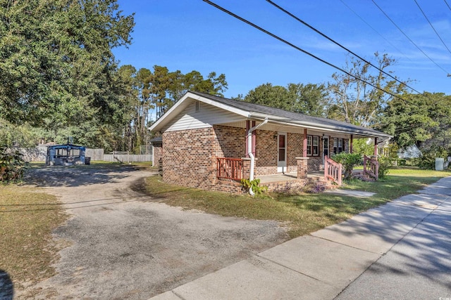 single story home with covered porch