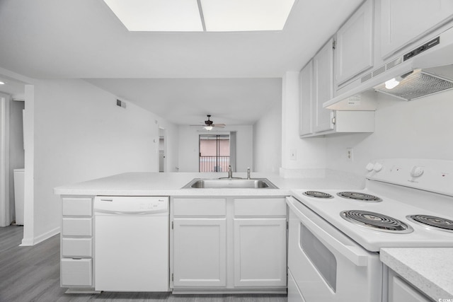 kitchen featuring white cabinetry, sink, white appliances, and custom exhaust hood