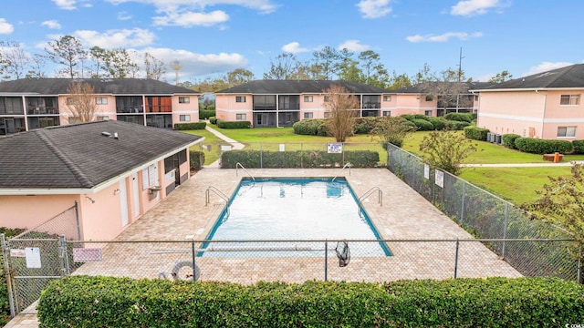 view of swimming pool with a patio