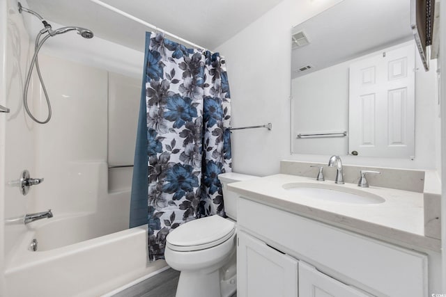 full bathroom featuring hardwood / wood-style floors, vanity, shower / bath combination with curtain, and toilet