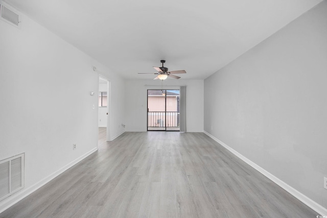 empty room with ceiling fan and light wood-type flooring