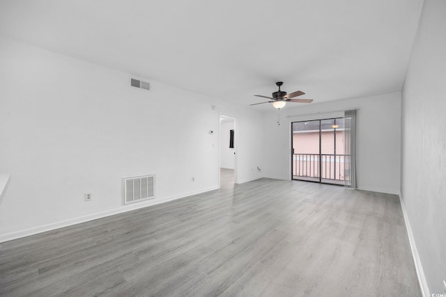 empty room featuring light hardwood / wood-style flooring and ceiling fan