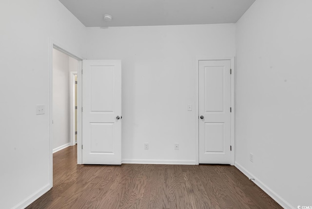 spare room with hardwood / wood-style floors