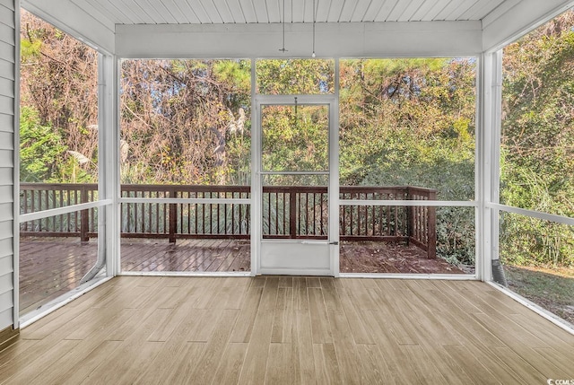 unfurnished sunroom with a wealth of natural light and wood ceiling