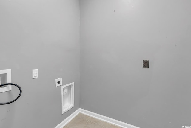 clothes washing area featuring washer hookup, light tile patterned floors, and electric dryer hookup