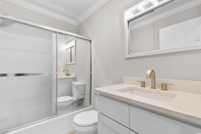 full bathroom featuring crown molding, toilet, vanity, and combined bath / shower with glass door