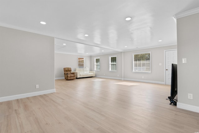 unfurnished living room with light hardwood / wood-style flooring and ornamental molding