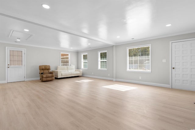 unfurnished living room featuring light wood-type flooring and crown molding