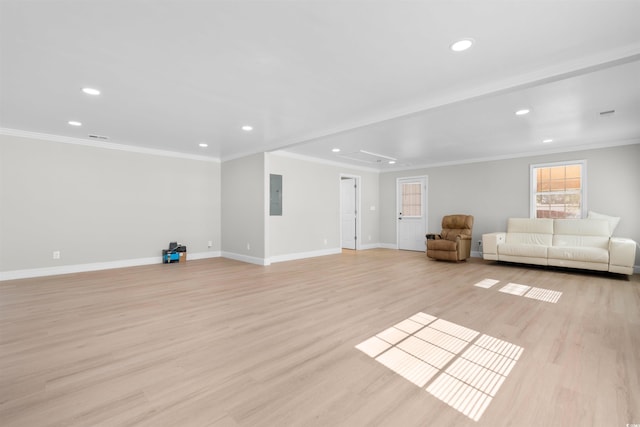 unfurnished living room with electric panel, crown molding, and light wood-type flooring