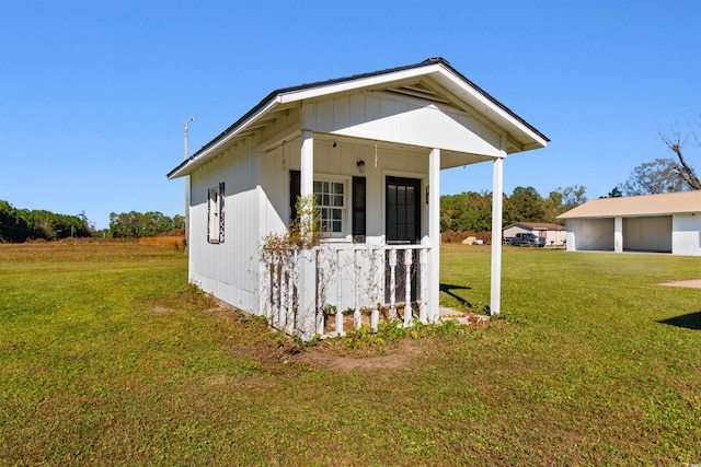 view of side of home featuring a yard