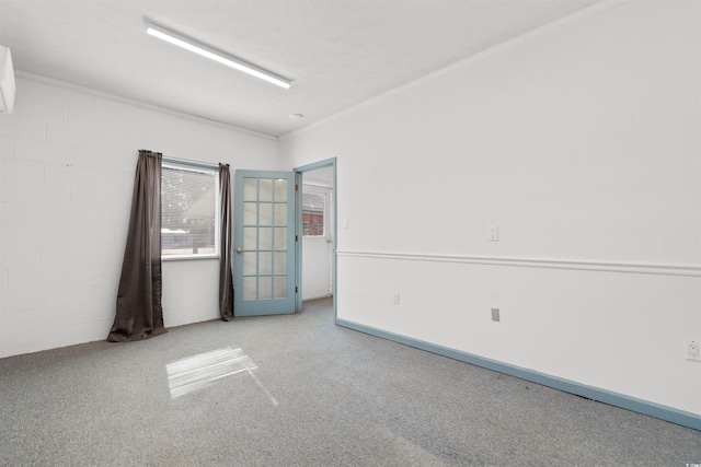 carpeted spare room with ornamental molding