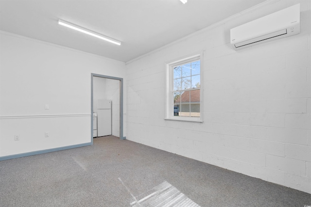 carpeted spare room featuring an AC wall unit and crown molding