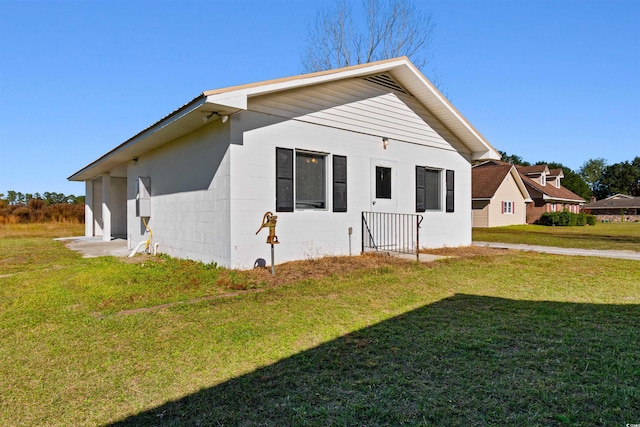 view of property exterior featuring a lawn