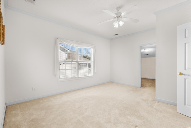 unfurnished room with light carpet, ceiling fan, and ornamental molding