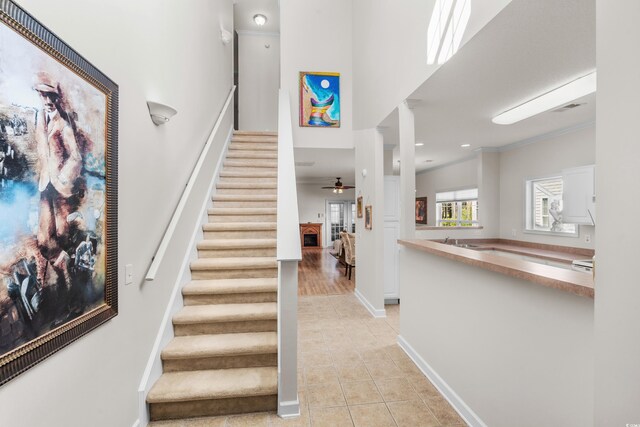 493 Shellbank Dr Unit 2-B, Longs, SC 29568 - stairway with tile patterned flooring, baseboards, ornamental molding, and a ceiling fan