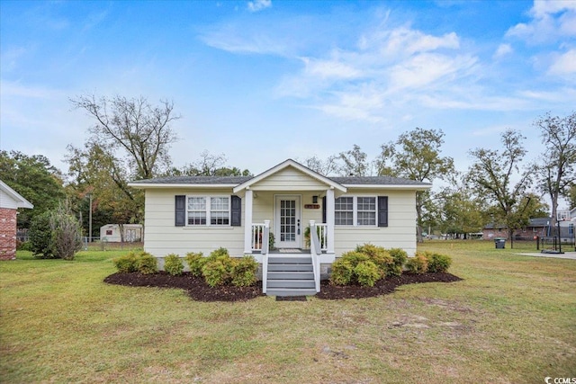 view of front of house featuring a front lawn and a porch