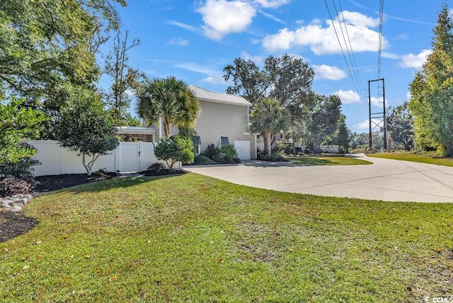 exterior space with a yard and a garage