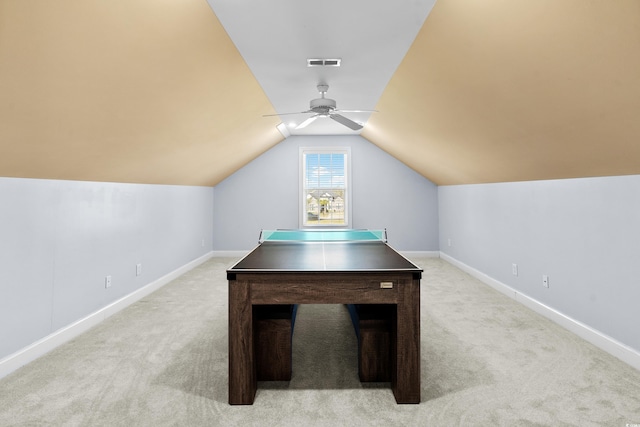 recreation room featuring ceiling fan, lofted ceiling, and light carpet