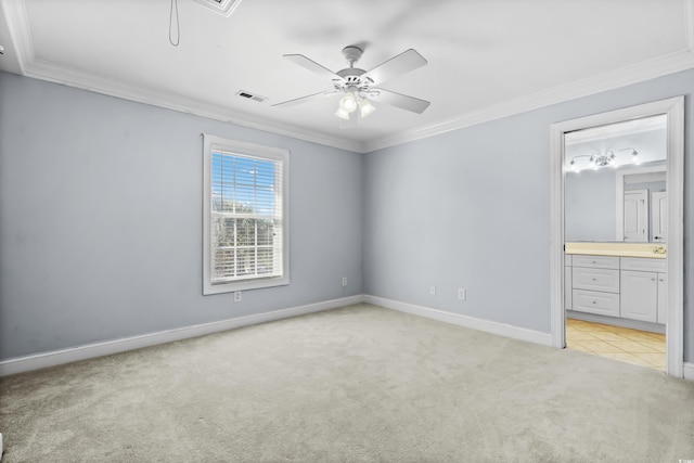 unfurnished bedroom with ensuite bath, ceiling fan, light colored carpet, and ornamental molding