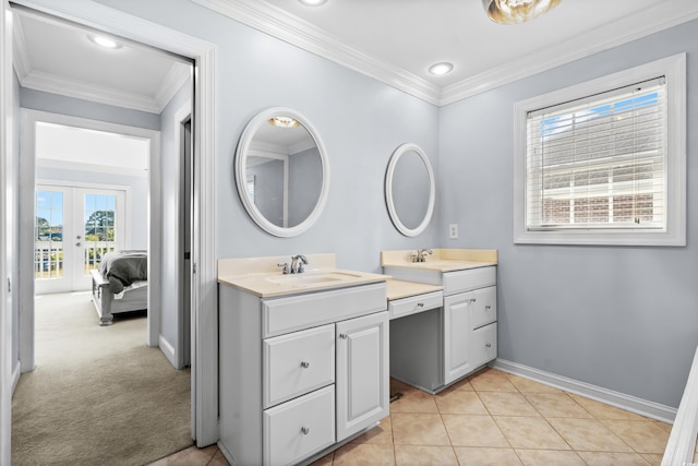 bathroom featuring tile patterned floors, vanity, crown molding, and french doors