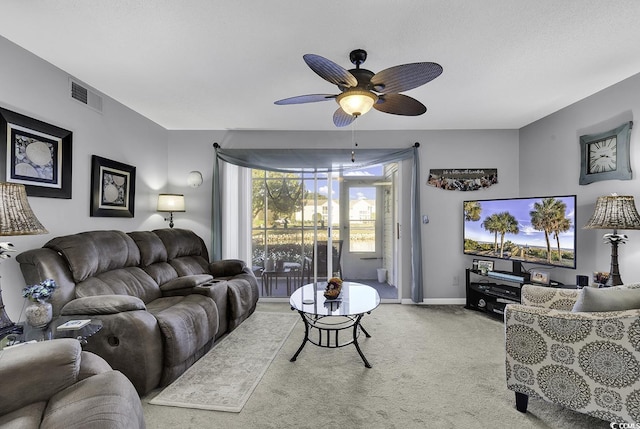 carpeted living room featuring ceiling fan