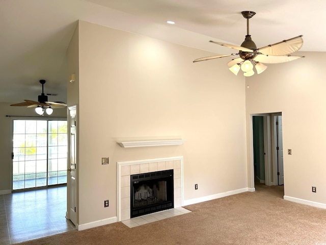 unfurnished living room featuring a fireplace, ceiling fan, light carpet, and high vaulted ceiling