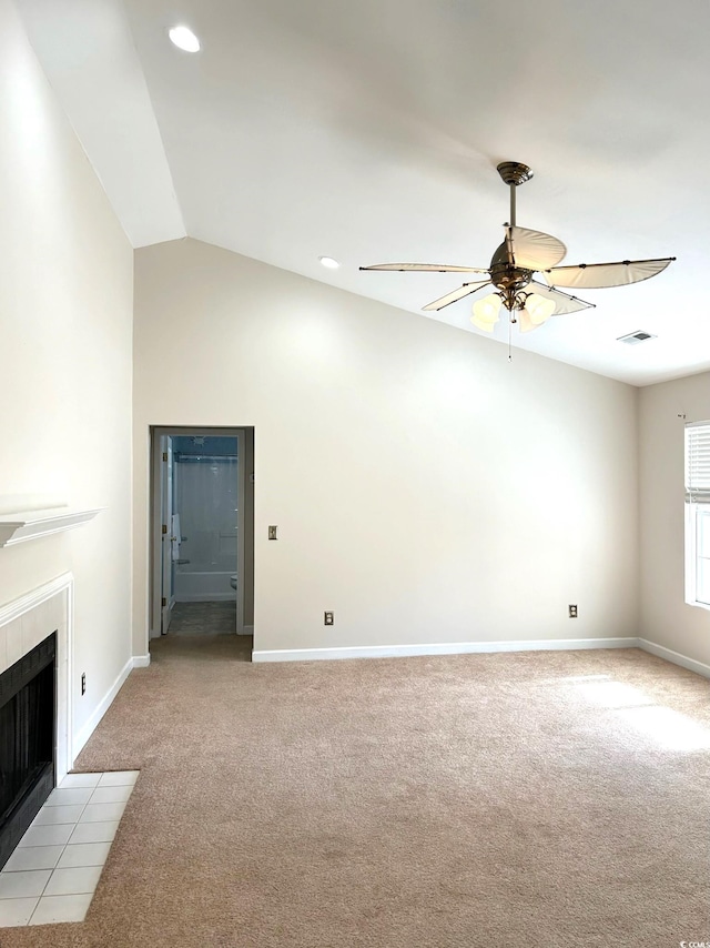 unfurnished living room with a fireplace, light carpet, ceiling fan, and lofted ceiling