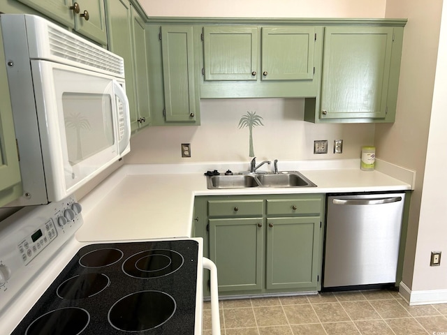 kitchen with green cabinets, white appliances, sink, and light tile patterned floors