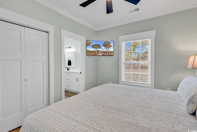 6001-1778 S Kings Hwy, Myrtle Beach, SC 29575 - bedroom featuring connected bathroom, sink, ceiling fan, crown molding, and a closet