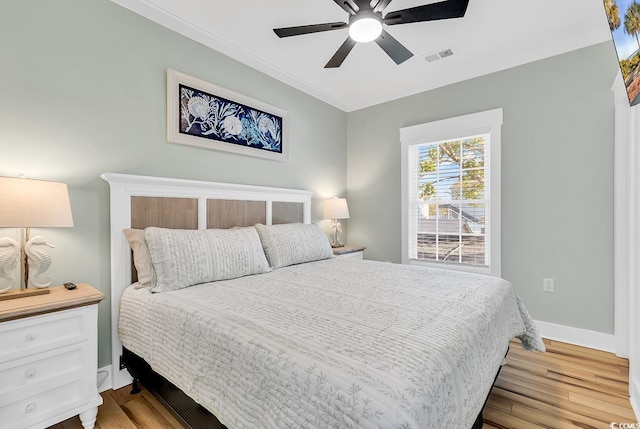 6001-1778 S Kings Hwy, Myrtle Beach, SC 29575 - bedroom with crown molding, light hardwood / wood-style floors, and ceiling fan