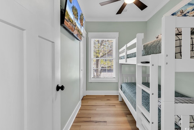 6001-1778 S Kings Hwy, Myrtle Beach, SC 29575 - bedroom with hardwood / wood-style flooring, ornamental molding, and ceiling fan