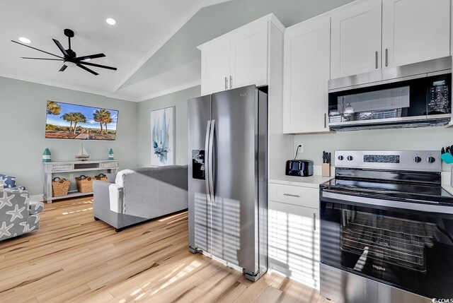 6001-1778 S Kings Hwy, Myrtle Beach, SC 29575 - kitchen featuring lofted ceiling, crown molding, appliances with stainless steel finishes, white cabinetry, and light hardwood / wood-style floors