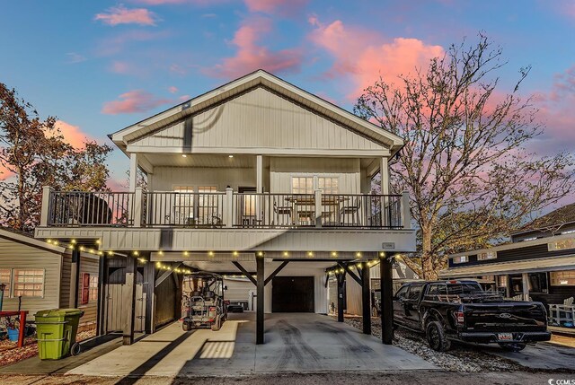 6001-1778 S Kings Hwy, Myrtle Beach, SC 29575 - view of front of house with a carport, a garage, and a balcony