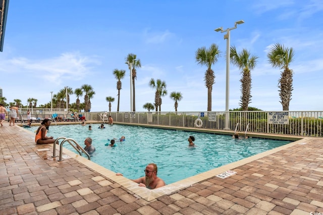 5200 N Ocean Blvd Unit 1231, Myrtle Beach, SC 29577 - community pool featuring a patio area