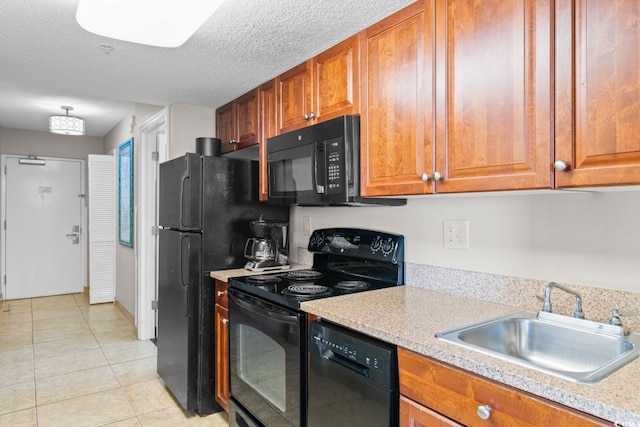5200 N Ocean Blvd Unit 1231, Myrtle Beach, SC 29577 - kitchen featuring black appliances, a sink, light countertops, brown cabinetry, and a textured ceiling