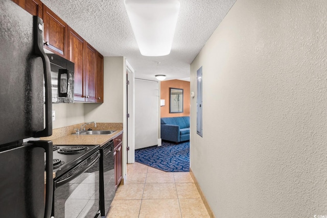 5200 N Ocean Blvd Unit 1231, Myrtle Beach, SC 29577 - kitchen with black appliances, a sink, a textured ceiling, a textured wall, and light countertops