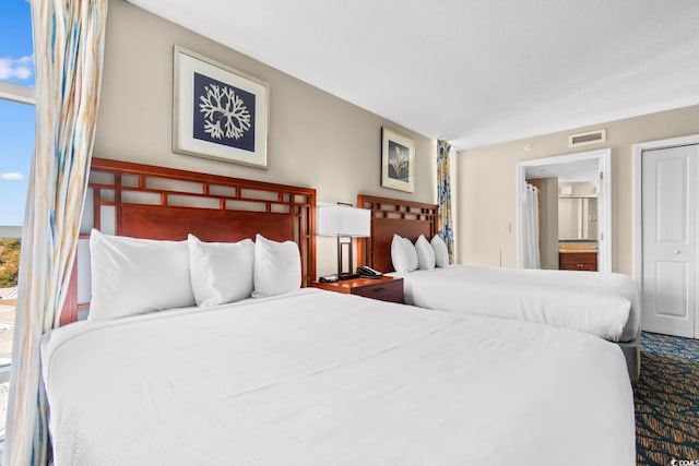 5200 N Ocean Blvd Unit 1231, Myrtle Beach, SC 29577 - bedroom with multiple windows and ensuite bath