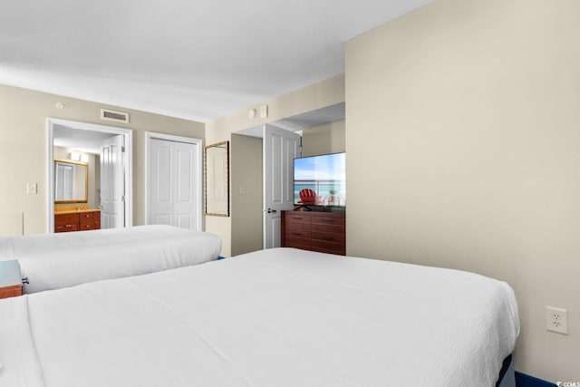 5200 N Ocean Blvd Unit 1231, Myrtle Beach, SC 29577 - bedroom with connected bathroom and a closet