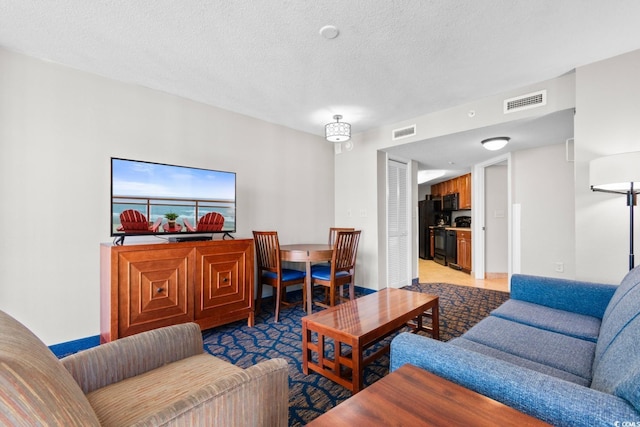 5200 N Ocean Blvd Unit 1231, Myrtle Beach, SC 29577 - living room featuring a textured ceiling