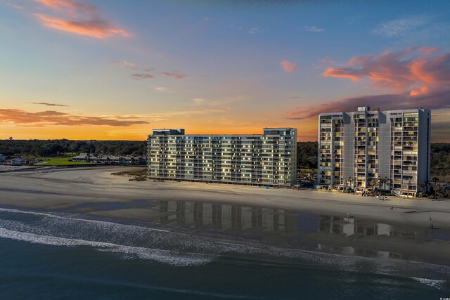 outdoor building at dusk featuring a water view