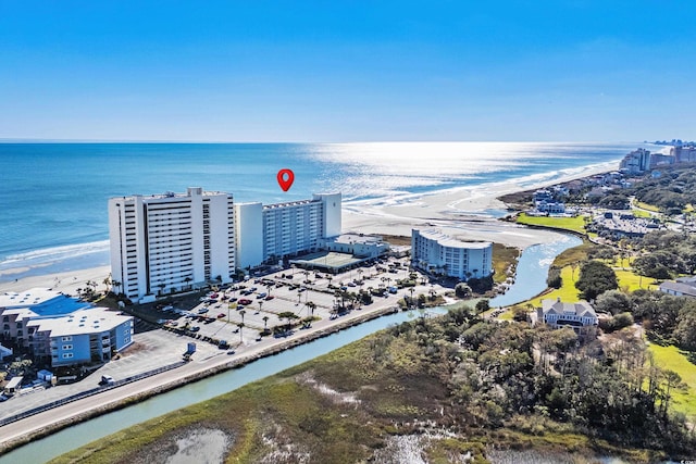 bird's eye view with a water view and a view of the beach