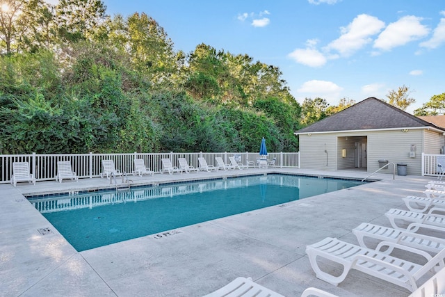 view of pool with a patio area and central AC