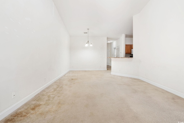 unfurnished living room featuring light carpet