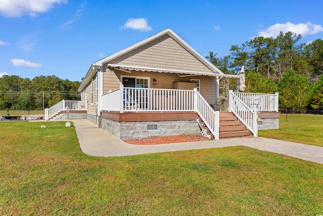 2580 Ash Little River Rd, Ash, NC 28420 - view of front of home featuring crawl space, a front lawn, stairway, and covered porch