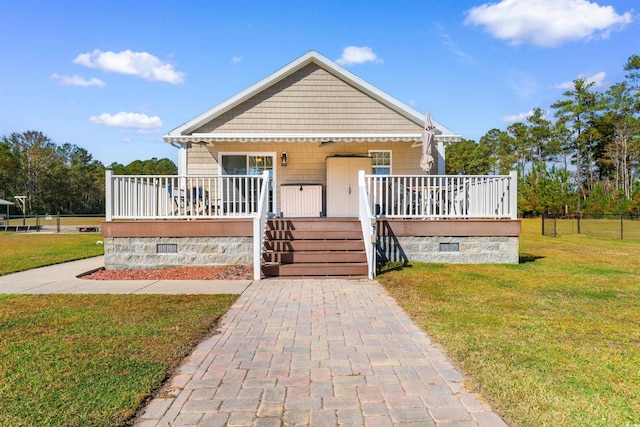 bungalow-style home with a porch and a front yard