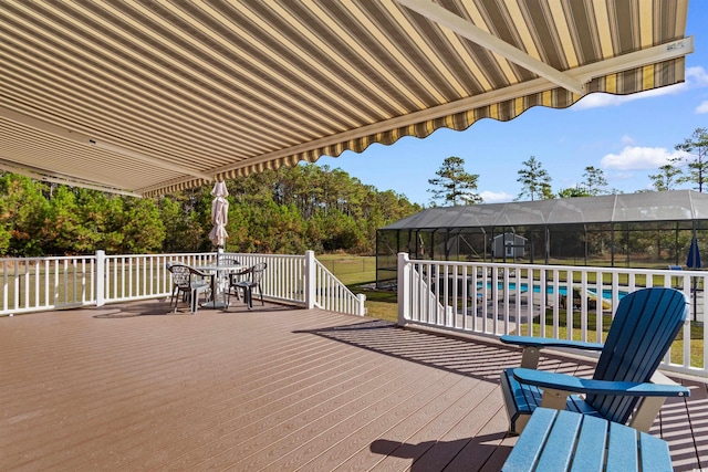 2580 Ash Little River Rd, Ash, NC 28420 - wooden terrace with outdoor dining area and a lanai