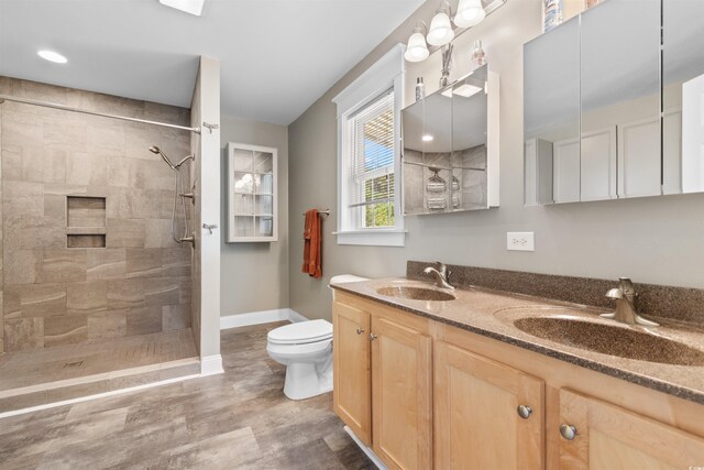2580 Ash Little River Rd, Ash, NC 28420 - full bath with toilet, baseboards, tiled shower, and double vanity
