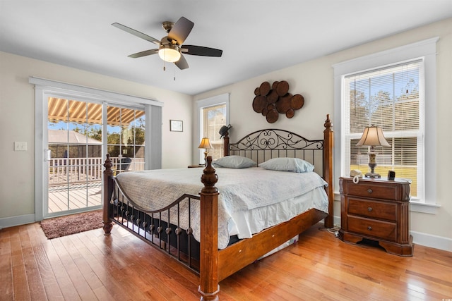 2580 Ash Little River Rd, Ash, NC 28420 - bedroom with access to exterior, hardwood / wood-style floors, baseboards, and a ceiling fan