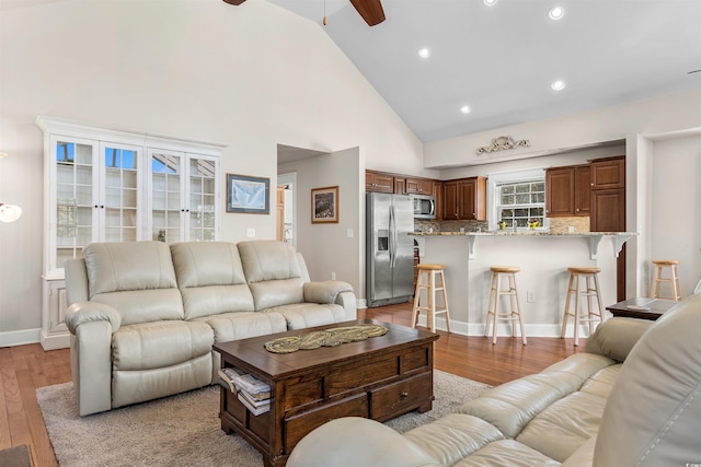 2580 Ash Little River Rd, Ash, NC 28420 - living area with ceiling fan, light wood-style flooring, high vaulted ceiling, recessed lighting, and baseboards