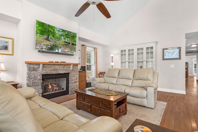 2580 Ash Little River Rd, Ash, NC 28420 - living area with high vaulted ceiling, ceiling fan, hardwood / wood-style flooring, a fireplace, and baseboards